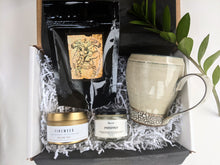 Load image into Gallery viewer, When we can't give a hug in person lets give a Hug in a Mug.   This versatile gift is welcomed by all as you can chop and change as you like.  Choose from A cream or green Emily Tolmie mug, Lucas teas or counterpart coffee, Xoco West Coast Chocolate or a Hollow Tree Candle.   Our gifts come beautifully wrapped with a bow along with an art card including your personal note. gift basket delivery  a box full of snacks  a little gift  a little something  anniversary gifts  amazing gifts  bath salts  BC  beautif