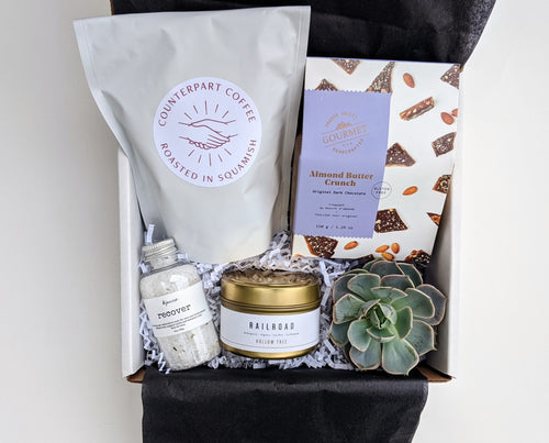 A little something beautiful for someone beautiful.  This box includes Counterpart Coffee Beans, Almond Butter Crunch, Bath Salts, Hollow Tree Travel Candle and an air plant or succulent.  Our gifts come beautifully wrapped with a bow along with an art card including your personalized note.